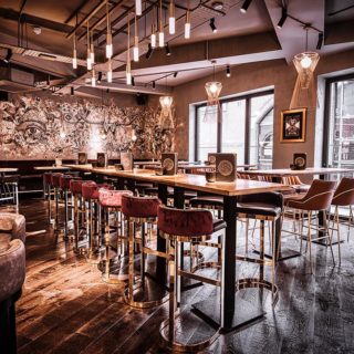Glow side chairs and Louvre fluted back bar stools at Alchemist Brindley Place Birmingham by DeFrae Comtract Furniture