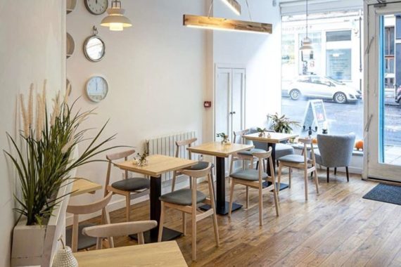 Michelle chairs solid wood tables with forza bases at Broken Clock cafe in Glasgow by DeFrae Contract Furniture wide