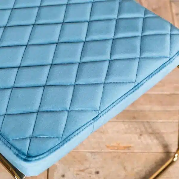 Marilyn Side Chair Quilted Back and Brass Look Frame DeFrae Contract Furniture Stackable Ocean Teal Blue Close Up