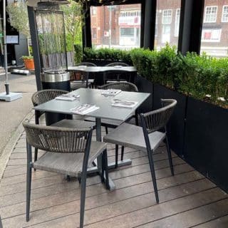 Vienna Side Chairs and Cement Compact Laminate Tables tops with alluminium flip top tablebase at Tom Dick & Harrys by DeFrae Contract Furniture