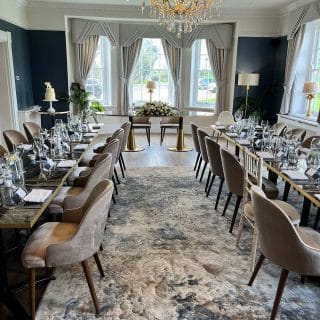 Claire side chairs with bespoke marbled cappucino tabletops at Downham Hall Wedding Venue by DeFrae header