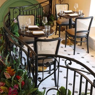 Restaurant furniture at Essence at The Pantiles by DeFrae Contract Furniture Cane back chairs and Bespoke Tables