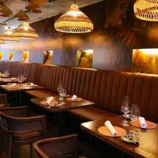 Selent Armchairs from DeFrae Contract Furniture Cane Wicker Back in RueViet Restaurant Vienna