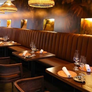 Selent Armchairs from DeFrae Contract Furniture Cane Wicker Back in RueViet Restaurant Vienna