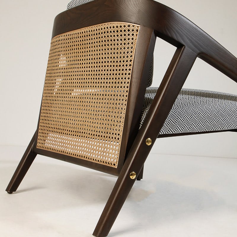 Close-up of cane/rattan backrest on the Nobly Chair – luxury hospitality furniture