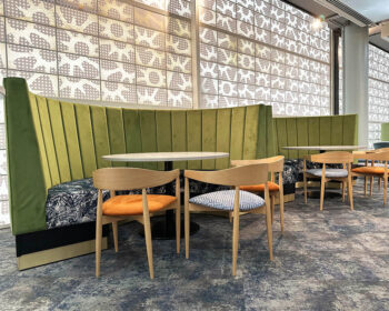 Curved Feature fluted banquette seating designed by DeFrae for the Chelsea FC Rose & Ball Hospitality Lounge.