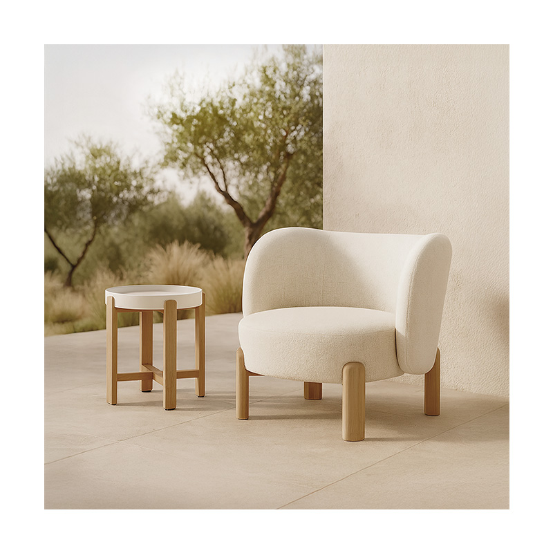 Natura teak outdoor lounge chair with padded Olefin cushion for outdoor hospitality venues including hotels and bars