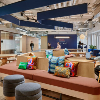 Custom banquette seating and collaborative workspace seating installed by DeFrae Contract Furniture at Talon OOH’s Soho headquarters.