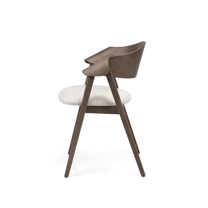 The Ondina Armchair features a sculpted wooden frame with upholstered seat and optional backrest or cane detail. Ideal for restaurants, hotels and hospitality interiors.