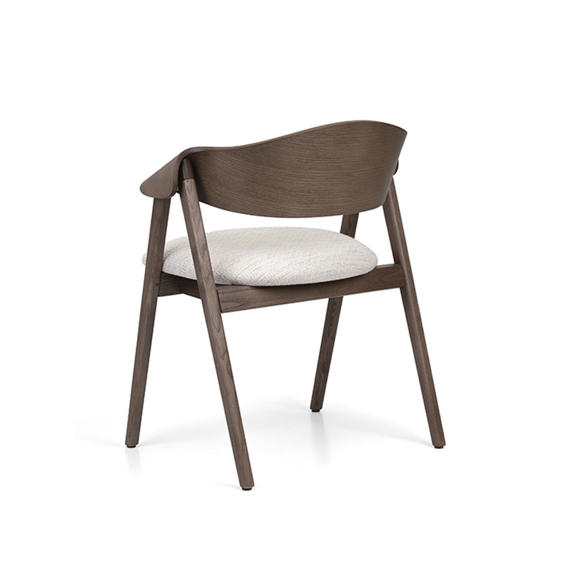 The Ondina Armchair features a sculpted wooden frame with upholstered seat and optional backrest or cane detail. Ideal for restaurants, hotels and hospitality interiors.